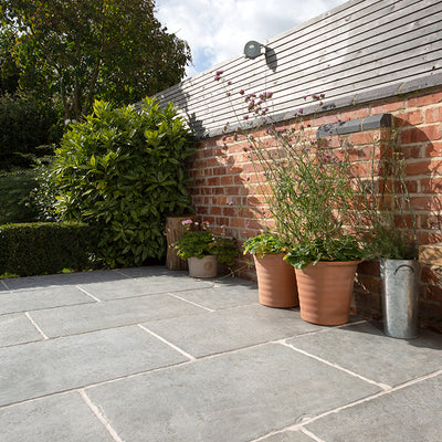 how to clean outdoor natural stone paving