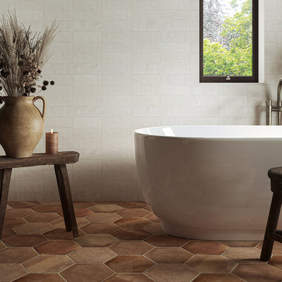 bathroom with a bath and terracotta hexagon tiles 
