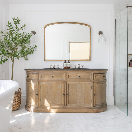 bathroom with vanity unit featuring Carrara marble tiles
