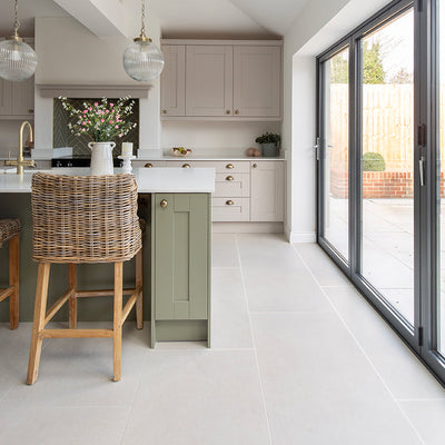 Frome Whitetiles in a kitchen with green cabinets 