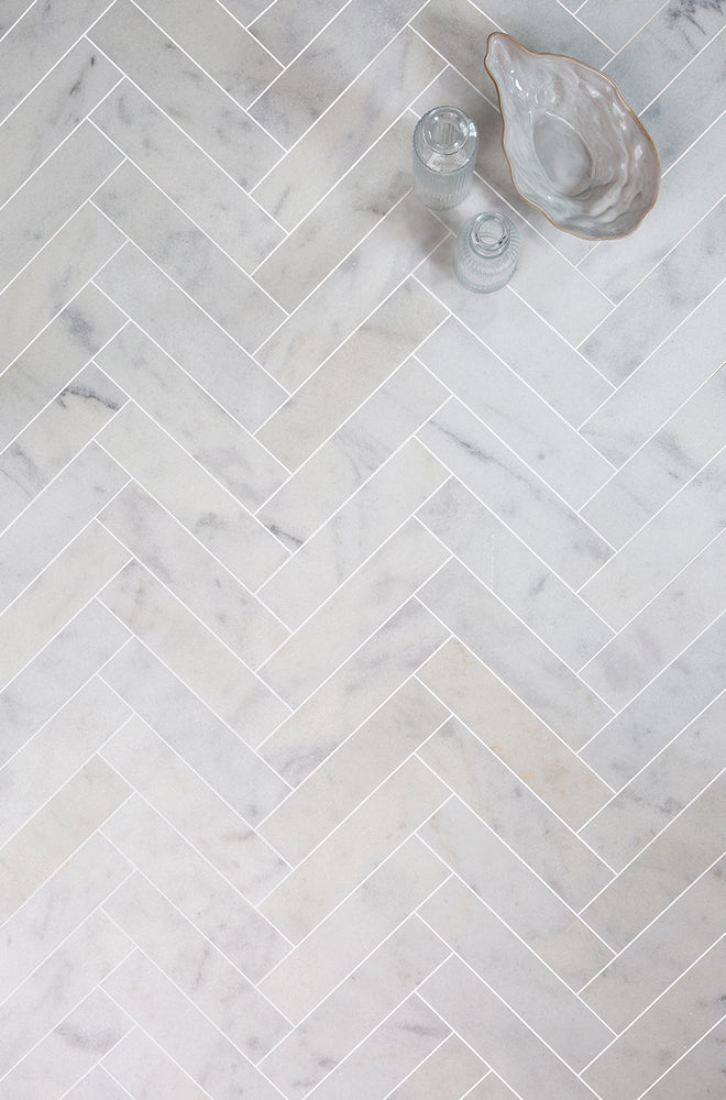 Carrara Bianco Honed Marble Herringbone Metro