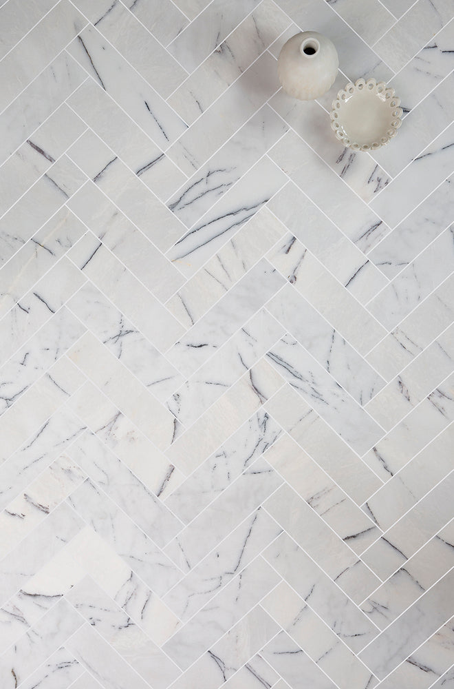 Carrara Viola Honed Marble Herringbone Metro