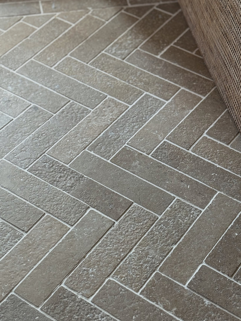 Dijon Seasoned Limestone Herringbone Tiles